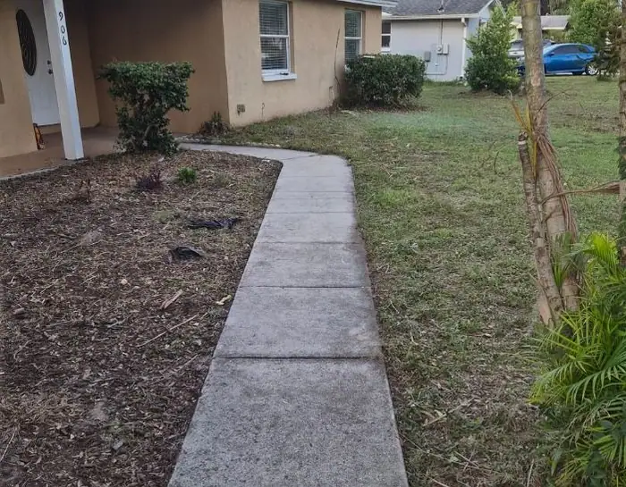 A walk and mulch bed edged clean by LoLo Lawncare